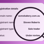 A magnifying glass over registrant details.